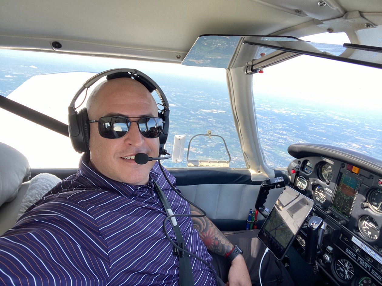 Ariel Legassa in the cockpit of a small aircraft